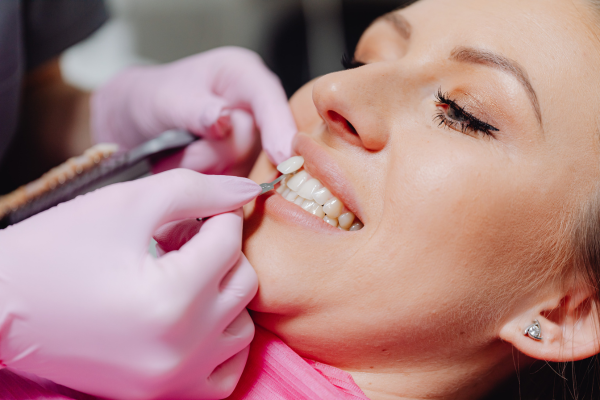 Woman having a veneer applied in our Naperville dentist office
