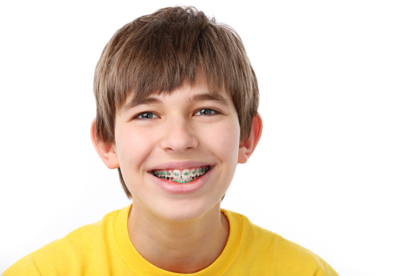A teenage boy with metal braces.